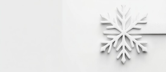 Elegant snowflake on a minimalist white background with space for text