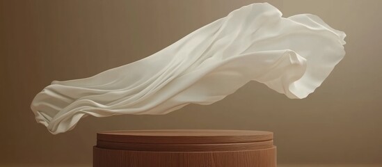 Elegant display platform with flowing fabric in neutral tones showcasing products