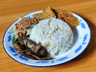 Nasi pecel or sego pecel is a typical Javanese Indonesian dish served with pecel sauce, which can...
