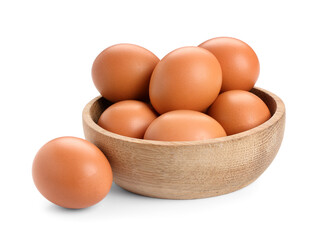Wooden bowl with brown chicken eggs on white background