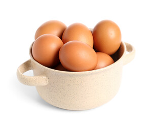 Pot with brown chicken eggs on white background