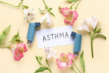 Paper sheet with word ASTHMA, inhalers and alstroemeria flowers on beige background