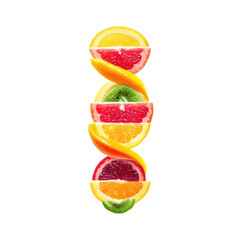 Vibrant Fresh Fruit Slices Tower Arrangement on Black Background Capturing the Essence of Summer and Healthy Living