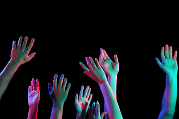 Toned many hands on dark background