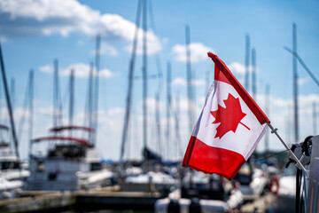 View of Canadian flag on boat at marina.