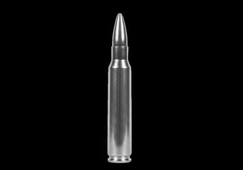 A single silver bullet cartridge with a pointed tip, isolated against a stark black background