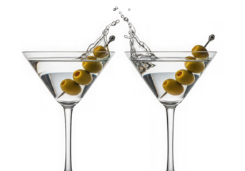 Two martini glasses clinking together with olives and a splash of liquid isolated on transparent background