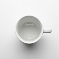 Top view of a clean white coffee mug on a white background