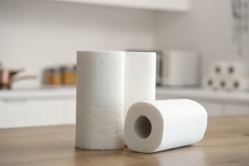 Rolls of paper towels on table in kitchen