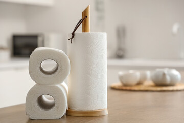 Rolls of paper towels on table in kitchen