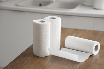 Rolls of paper towels on table in kitchen