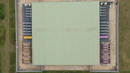 Top down aerial drone view of large data center in England, UK futuristic cutting edge technology with cooling fans and quantum computing data storage. - Powered by Adobe