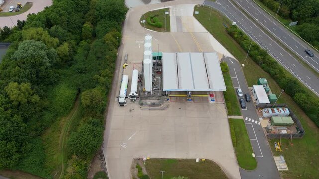 Aerial drone view of gas terminal, HGV trucks loading LGP gas for industrial purposes and transport, coal gas oil, England UK