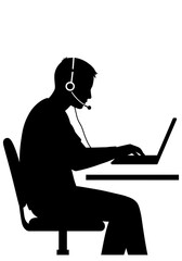 Silhouette_of_a_person_with_a_headset_seated_at_a_desk_using_a_laptop