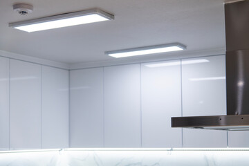 range hood and cabinet with lamps at the kitchen