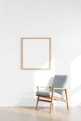 Minimalist interior with a grey armchair and a blank wooden picture frame on a white wall
