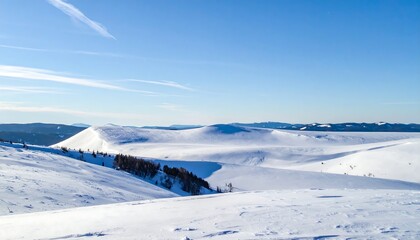 Snowy mountain landscape on a clear with sunny day in the French Alps.