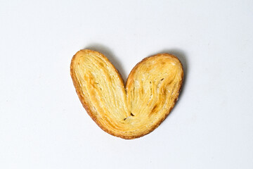 Top view of one mini pies isolated on white background. Clipping path. Love sign. Close up. High angle, above. Danish. Pastry. Butter. Heart.