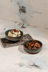 vanilla ice cream and chocolate ice cream in a stone bowl in photography art