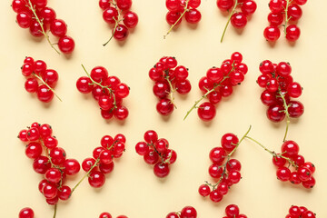 Fresh red currants on yellow background