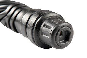 Close-up of a dark, cylindrical device with textured exterior and a black connector