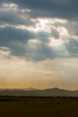 Vertical Horizon Blue golden sky sunrise dramatic beautiful landscape mountain. Dawn sky gold time cloudscape. Vertical Dramatic sunset over mountain landscape. Beautiful landscape fog morning hills