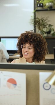 After reviewing charts, worker is toting yoga mat, tote bag, waving coworker, heading to yoga class