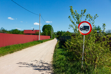 Sign prohibiting the passage of trucks installed before entering a village, Russia