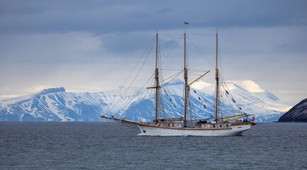 Beautiful vintage sailboat departing Longyearbyen in Svalbard, Norway
