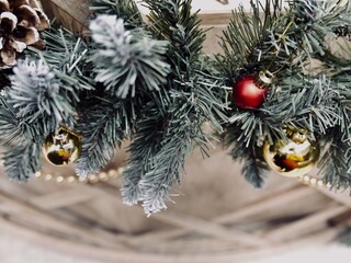 Christmas tree branches and colorful balls decoration close-up