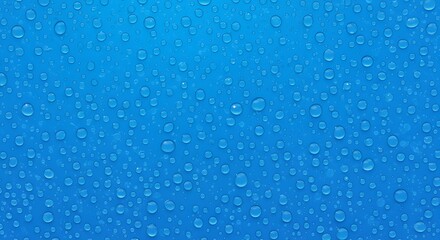 Water Droplets on Blue Surface: Delicate water droplets adorn a vibrant blue surface, showcasing the simple elegance and natural textures.
