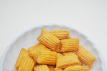Pang-Pang Cake or Pillow Cake, a typical Indonesian sweet snack placed on a small plate.