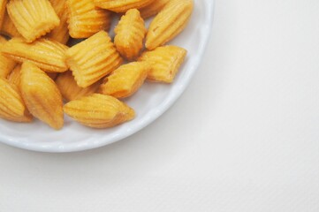 Pang-Pang Cake or Pillow Cake, a typical Indonesian sweet snack placed on a small plate.