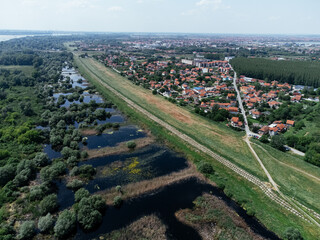 Residential edge of Belgrade suburb overlooking wetlands and forest near Pancevo. g.