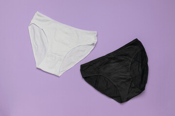 Minimalist Design: Black and White Cotton Underwear on Pastel Purple Background