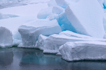 Blue light reflections in the arctic ice north of Svalbard, Norway © Reto Ammann