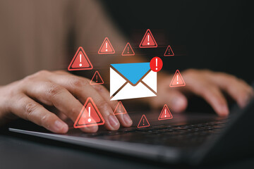 A man typing on a laptop with warning email icons, representing email threat, phishing attack, malware, data breach, cybersecurity alert, scam message, spam risk, and online fraud protection.
