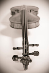 Black and white Old violin laying down on a white background