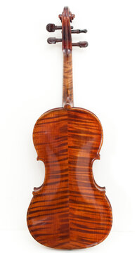 Old violin flame wood back side on a white background