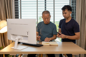 a father and son are spending their free time together at home, the son spends his weekend visiting his elderly father, a family full of love between a father and son