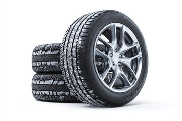 Stack of three winter tires with alloy rims on white background