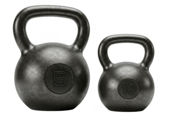 Two cast iron kettlebells of different sizes, used for fitness training, isolated on a transparent background