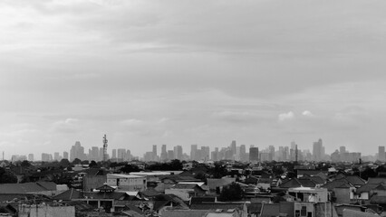 Obraz premium view from the parking lot showing tall buildings in the distance, black and white photo