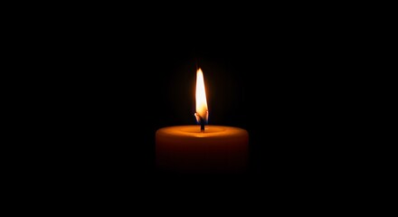 candle burning in darkness, great for use in spiritual messages, mindfulness apps, or atmospheric backgrounds.