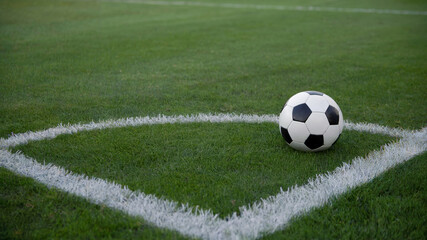 Soccer Ball on Corner of Green Football Field