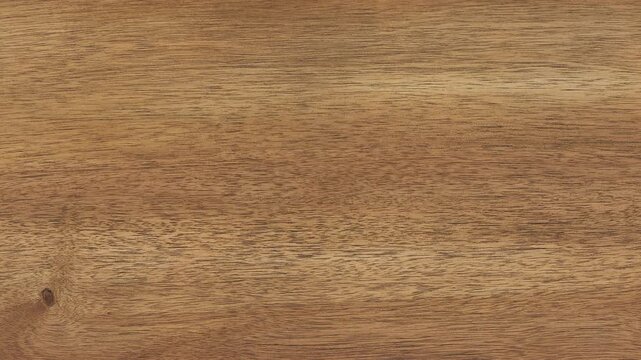 Camera pans across dining tabletop revealing intricate wood grain
