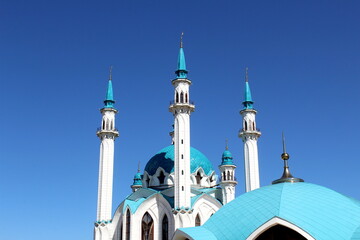 Against the backdrop of the sky there is a mosque with towers.
