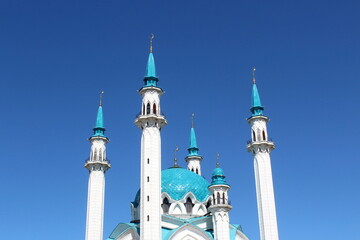 Against the backdrop of the sky there is a mosque with towers.