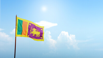 Sri Lanka national flag waving in the sky with a blue sky background. Concept of Sri Lanka Independence Day