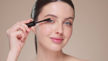 Beauty woman applying black mascara on eyelashes with makeup brush. Eyelash extensions. makeup, cosmetics. beauty, skincare - Powered by Adobe